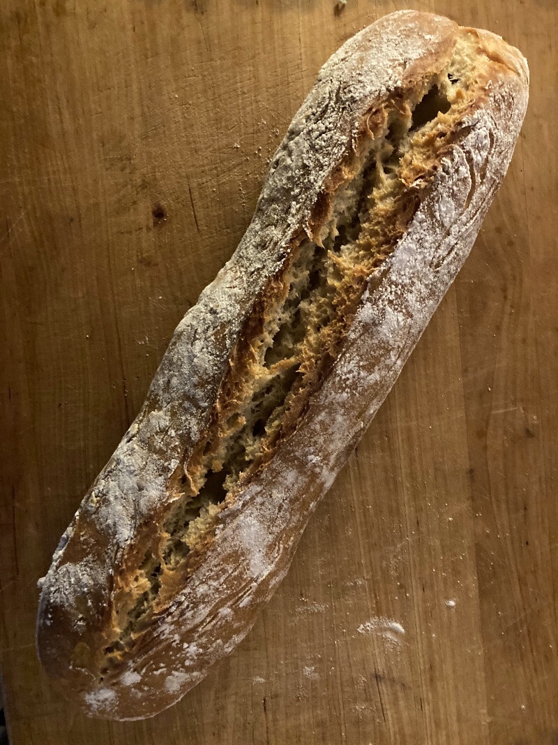 A loaf of bread on a cutting board
